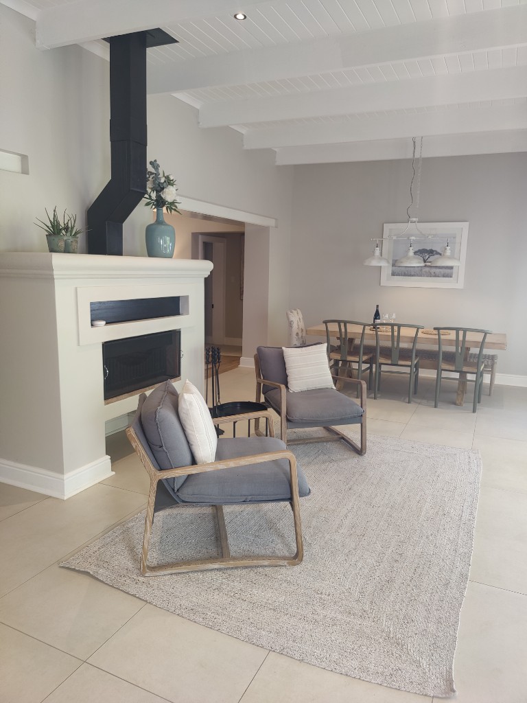 Open-plan living and dining with fireplace