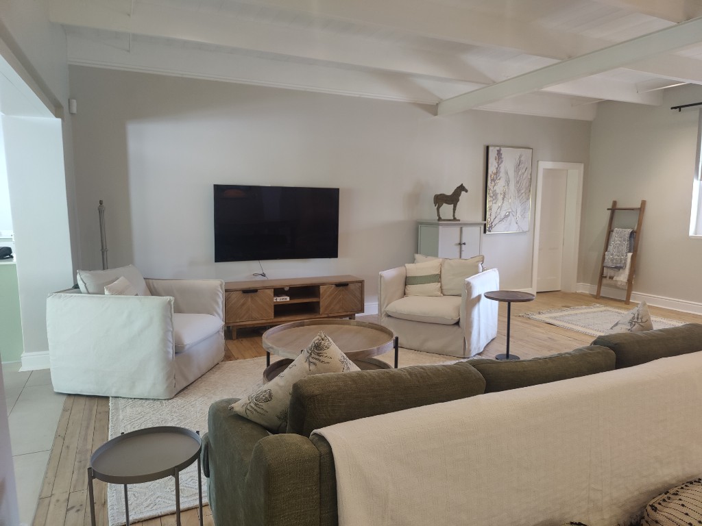 Spacious lounge with Smart TV and comfortable seating